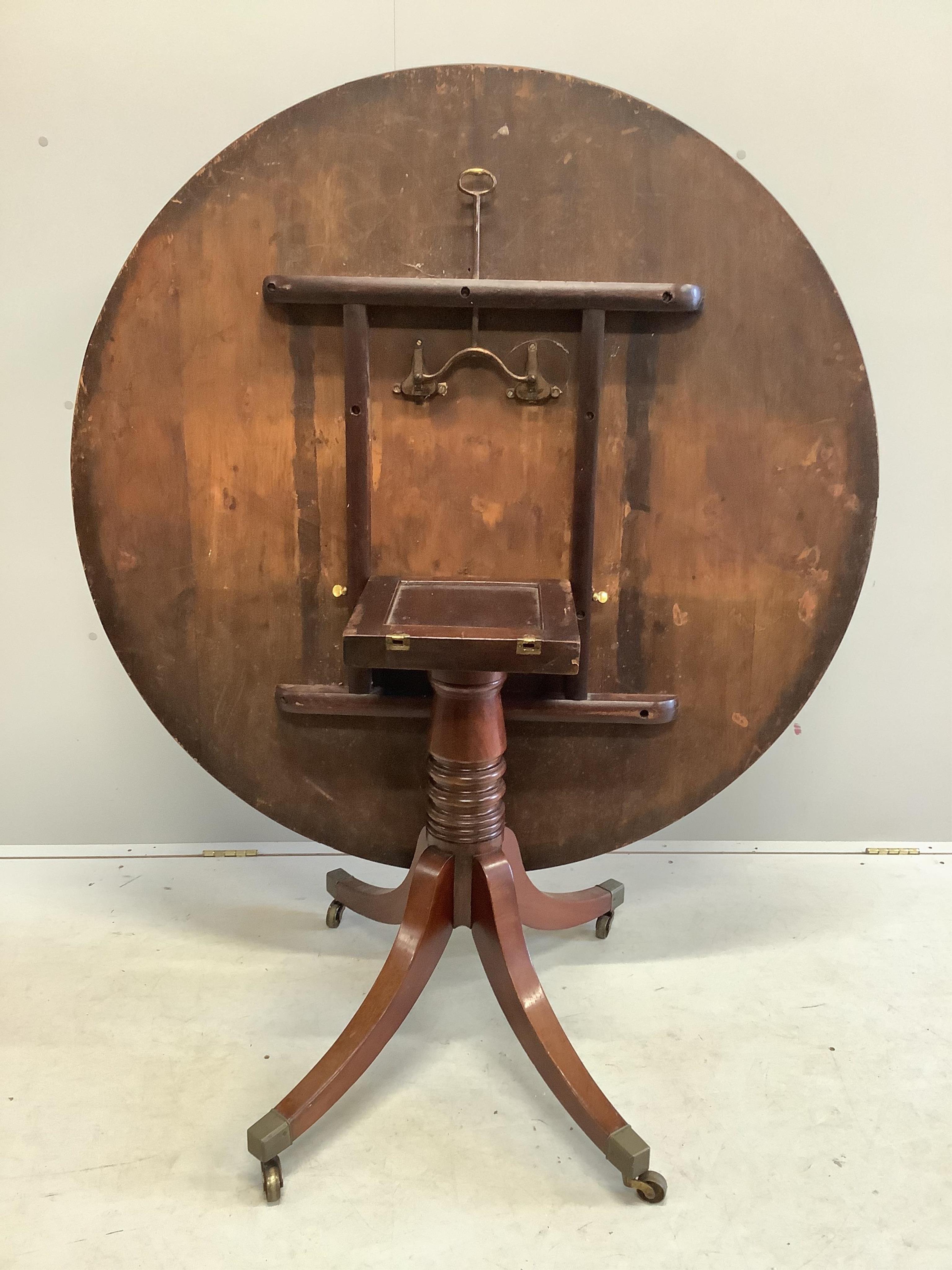 A George III circular mahogany tilt top breakfast table, diameter 120cm, height 71cm. Condition - fair to good